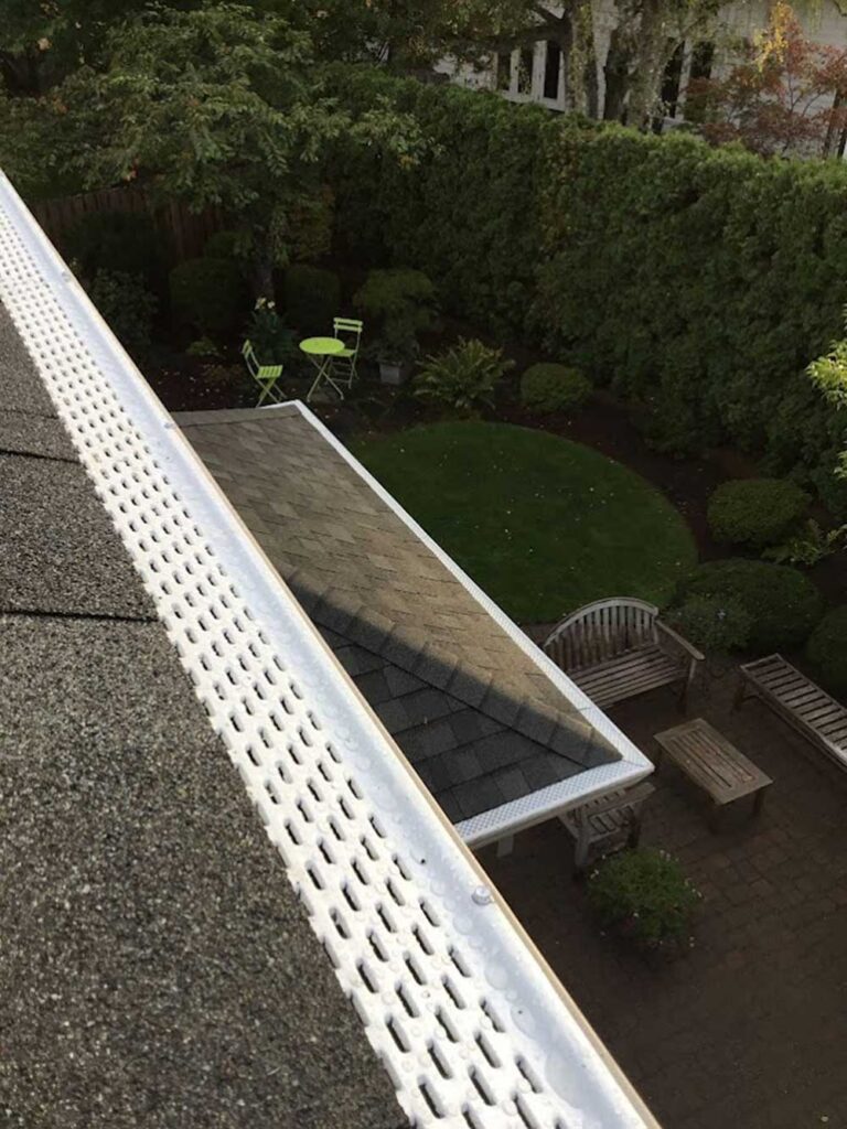 Gutter protection acts as a barrier, allowing water to flow while preventing clogs