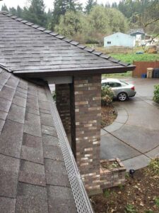 A Residential Chocolate Brown Gutter Guard Installation by Affordable Roofing & Gutter Company in Albany, Oregon