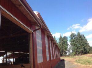 A Farm Colonial Red Gutter Installation by Affordable Roofing & Gutter Company in Albany, Oregon