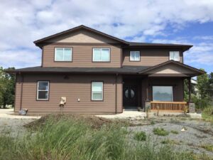 A Residential Chocolate Brown Gutter Installation by Affordable Roofing & Gutter Company in Albany, Oregon