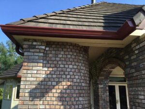 A Residential Colonial Red Gutter Installation by Affordable Roofing & Gutter Company in Albany, Oregon