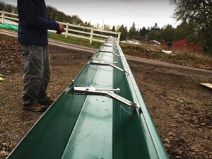 A Outbuilding Forest Green Gutter Guard Installation by Affordable Roofing & Gutter Company in Corvallis, Oregon