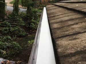 A Residential Pebble Stone Clay Gutter Installation by Affordable Roofing & Gutter Company in Corvallis, Oregon