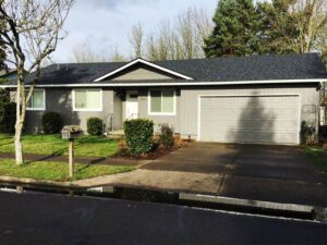 A Residential White Gutter Guard Installation by Affordable Roofing & Gutter Company in Eugene, Oregon