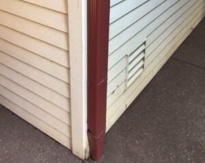 A Residential Colonial Red Gutter Installation by Affordable Roofing & Gutter Company in Eugene, Oregon