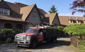 A Residential Colonial Red Gutter Installation by Affordable Roofing & Gutter Company in Eugene, Oregon