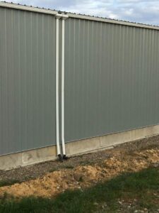 A Outbuilding White Gutter Installation by Affordable Roofing & Gutter Company in Lebanon, Oregon