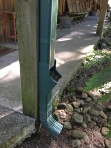 A Residential Forest Green Gutter Installation by Affordable Roofing & Gutter Company in Lebanon, Oregon