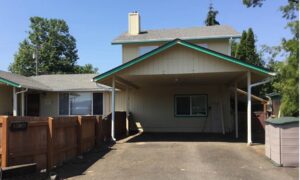 A Residential White Gutter Installation by Affordable Roofing & Gutter Company in Lebanon, Oregon