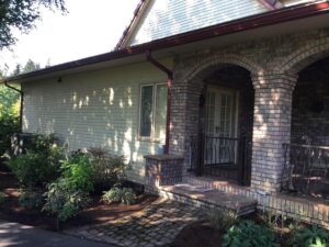 A Residential Colonial Red Gutter Installation by Affordable Roofing & Gutter Company in Portland, Oregon