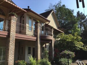 A Residential Colonial Red Gutter Installation by Affordable Roofing & Gutter Company in Portland, Oregon