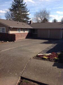 A Residential Pebble Stone Clay Gutter Installation by Affordable Roofing & Gutter Company in Portland, Oregon