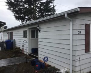 A Residential White Gutter Installation by Affordable Roofing & Gutter Company in Portland, Oregon