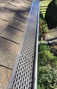 A Farm Forest Green Gutter Guard Installation by Affordable Roofing & Gutter Company in Salem, Oregon